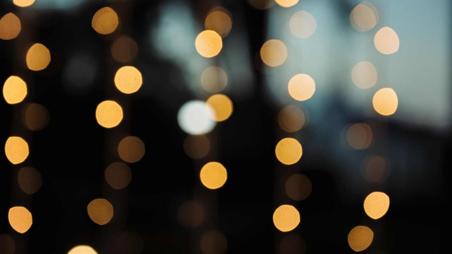 Abstract background with soft focus and gentle light trails.