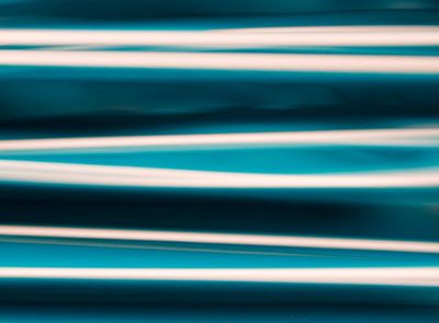 Abstract light streaks indicating smooth, flowing motion.